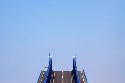 Low angle view of buildings against clear blue sky