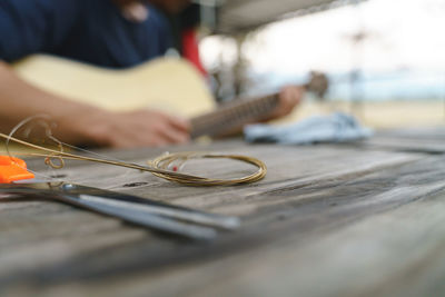 Man playing guitar on table