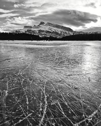Scenic view of lake against sky during winter