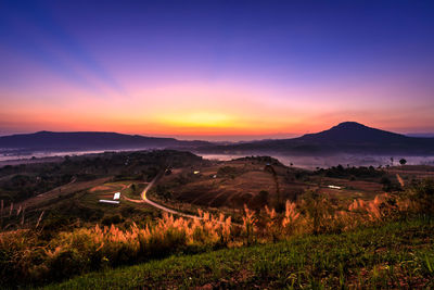 Scenic view of landscape against sky during sunset