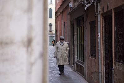 Full length of man standing on street