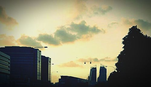 Low angle view of building against cloudy sky