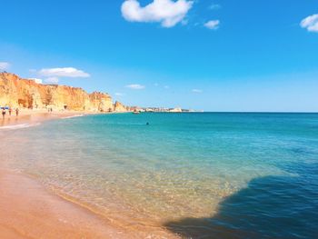 View of beach against cloudy sky