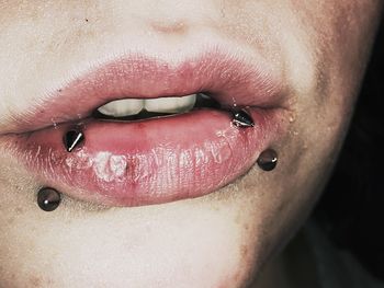 Cropped image of woman with pierced lips