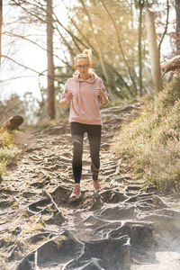 Full length of woman standing on ground