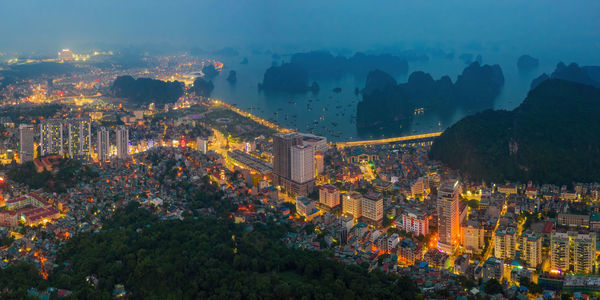 High angle view of illuminated buildings in city