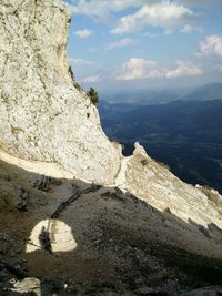 Scenic view of mountain against cloudy sky