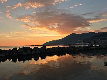 Scenic view of lake against sky during sunset