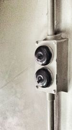 Close-up of old toggle switch buttons on wall