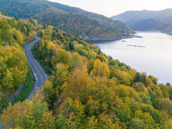 Idyllic road by the lake in autumn