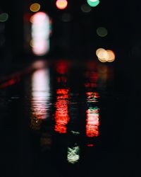 Close-up of illuminated reflection in water