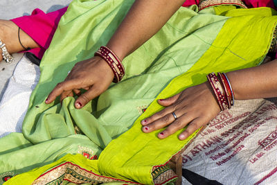 High angle view of woman lying on bed