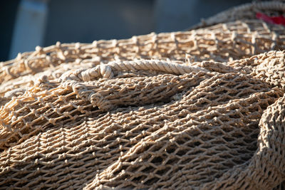 Close-up of rope tied on bollard