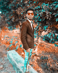 Portrait of young man standing outdoors