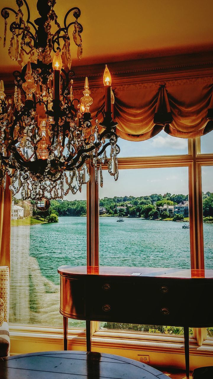 SCENIC VIEW OF SEA AGAINST SKY SEEN THROUGH DOORWAY