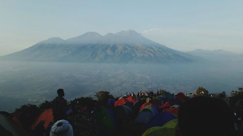 Group of people looking at mountain range