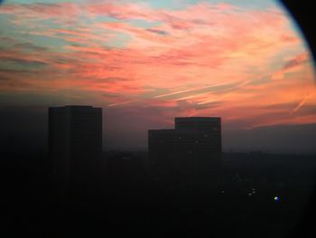 Cityscape against sky during sunset