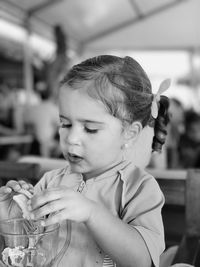 Close-up of cute girl looking away