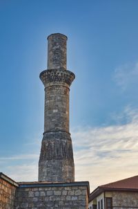 Low angle view of old historic building against blue sky