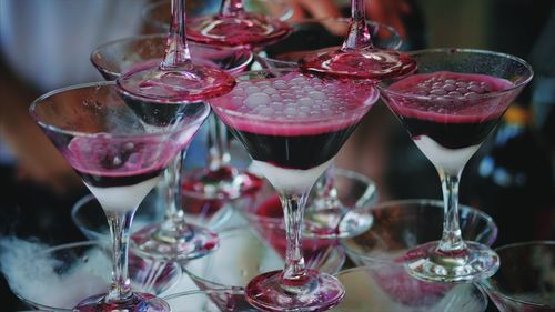 Close-up of martini glasses on table