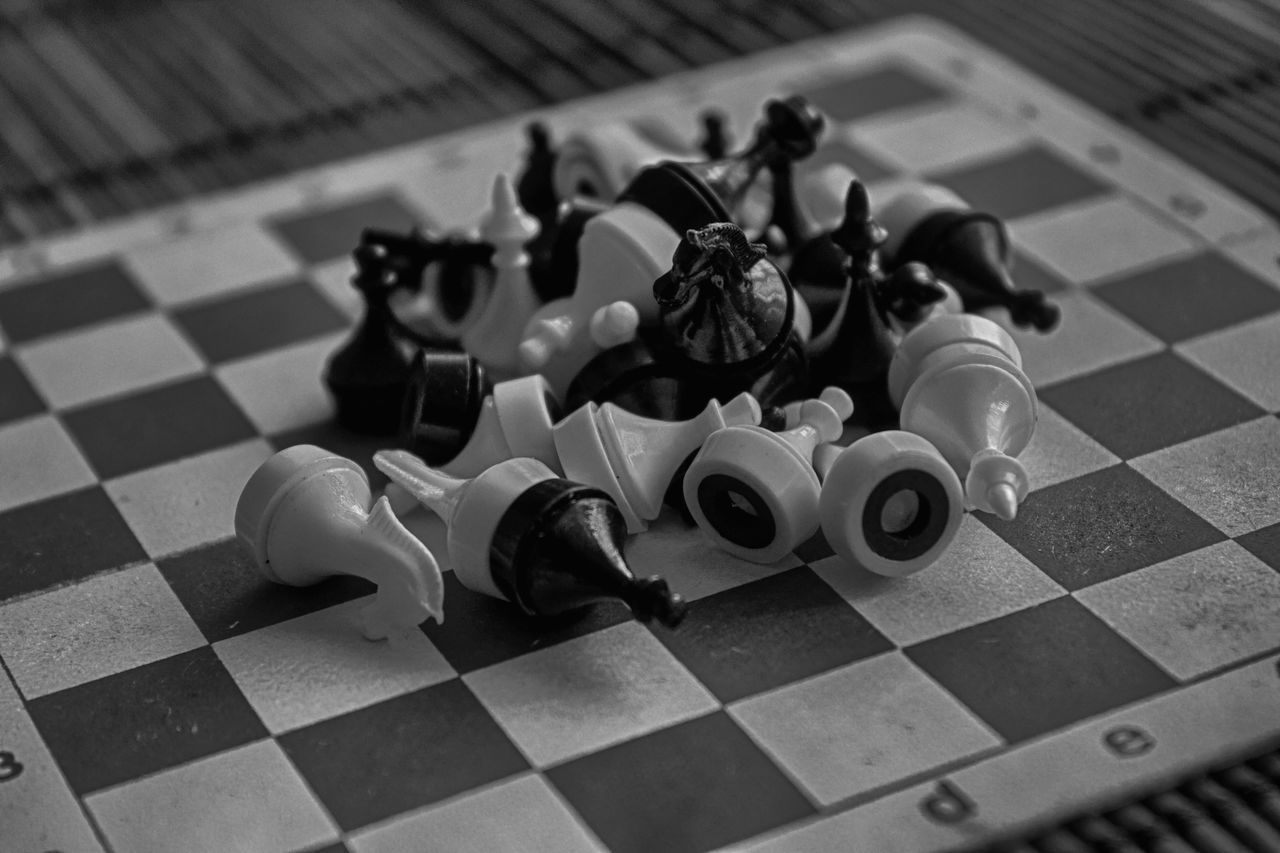 HIGH ANGLE VIEW OF CHESS TOY ON FLOOR