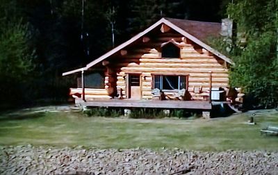 House by lake in forest