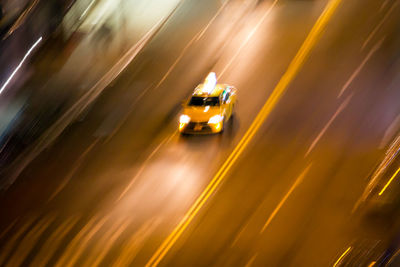 Blurred motion of taxi on road