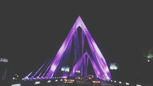 Low angle view of light trails at night