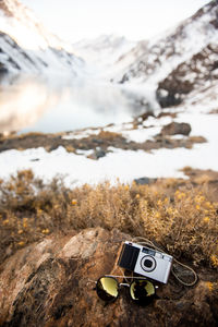 A tourist's treasured gear overlooking a mountain pass