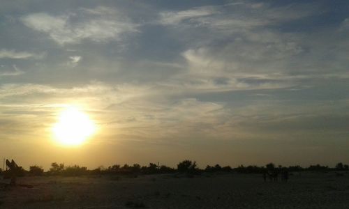 Scenic view of landscape at sunset