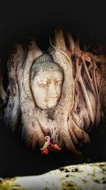 Close-up of buddha statue in temple