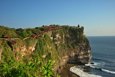 Sea cliff face on uluwatu temple in bali, indonesia - beautiful view