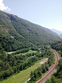 High angle view of road by mountain against sky