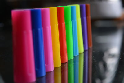 Close-up of multi colored pencils on table