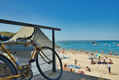 Scenic view of beach against clear blue sky