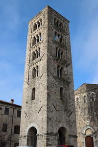 Low angle view of old building against clear blue sky