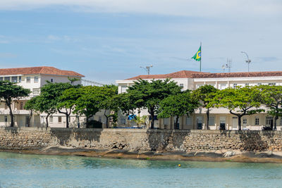 View of swimming pool against buildings