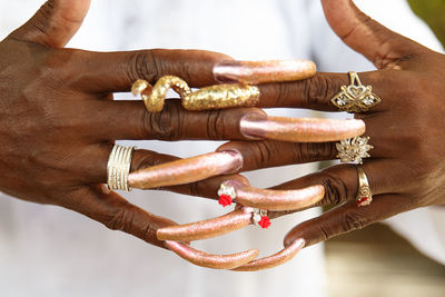 Close-up of woman with long fingernails