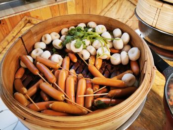 High angle view of mushrooms in basket on table