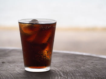 Close-up of beer glass on table