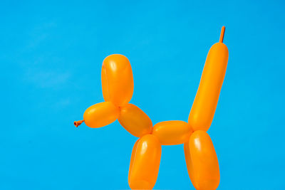 Directly above shot of red heart shape against blue background