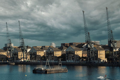 Sailboats in sea against sky