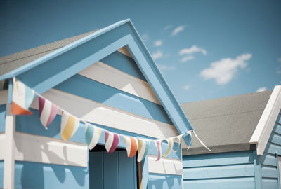 Close-up of beach huts on sunny day