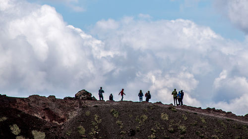 Scenic view of landscape against cloudy sky