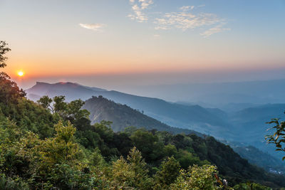 Scenic view of mountains at sunset