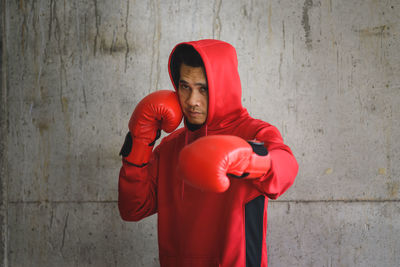 Male boxer against wall