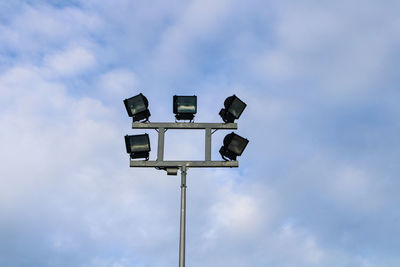 Low angle view of floodlight against sky