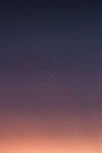 Low angle view of moon against sky at night