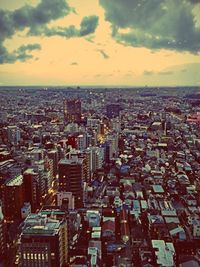 Cityscape against cloudy sky