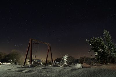 Scenic view of field against sky at night